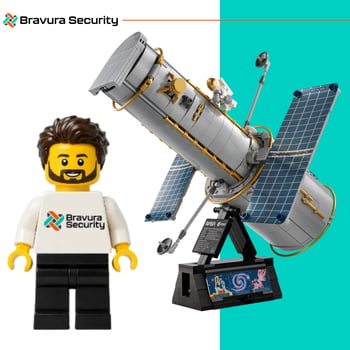 Lego figure wearing a Bravura Security Shirt and the Lego Hubble Space Telescope Set Lego figure wearing a Bravura Security Shirt and the Lego Hubble Space Telescope Set