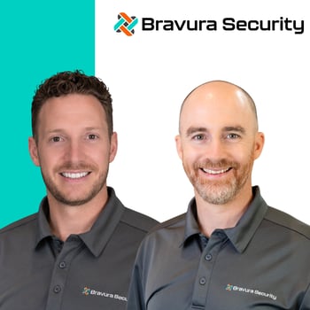 Two Bravura Security staff wearing branded polos Two Bravura Security staff wearing branded polos