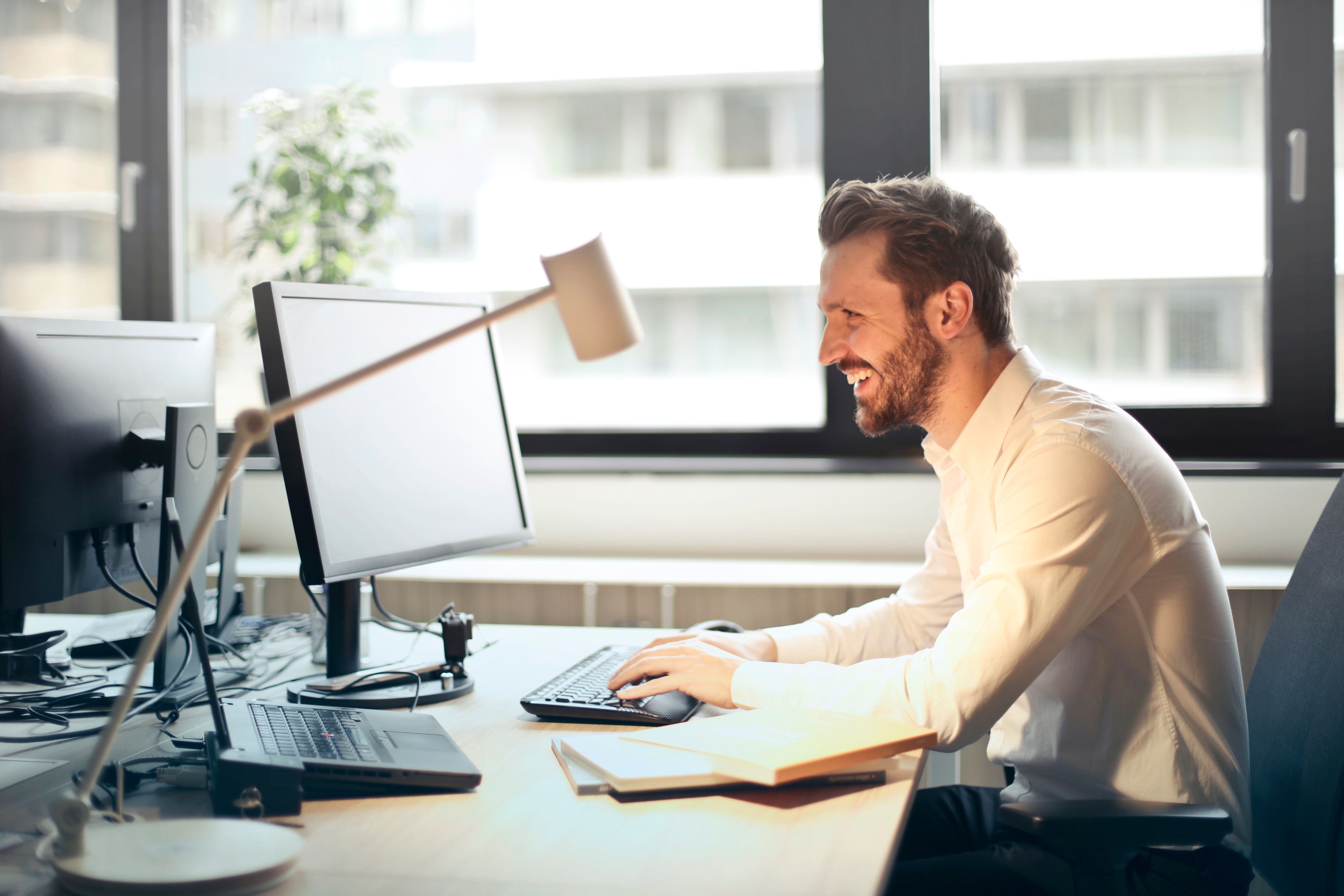 Man sitting at desk working at computer