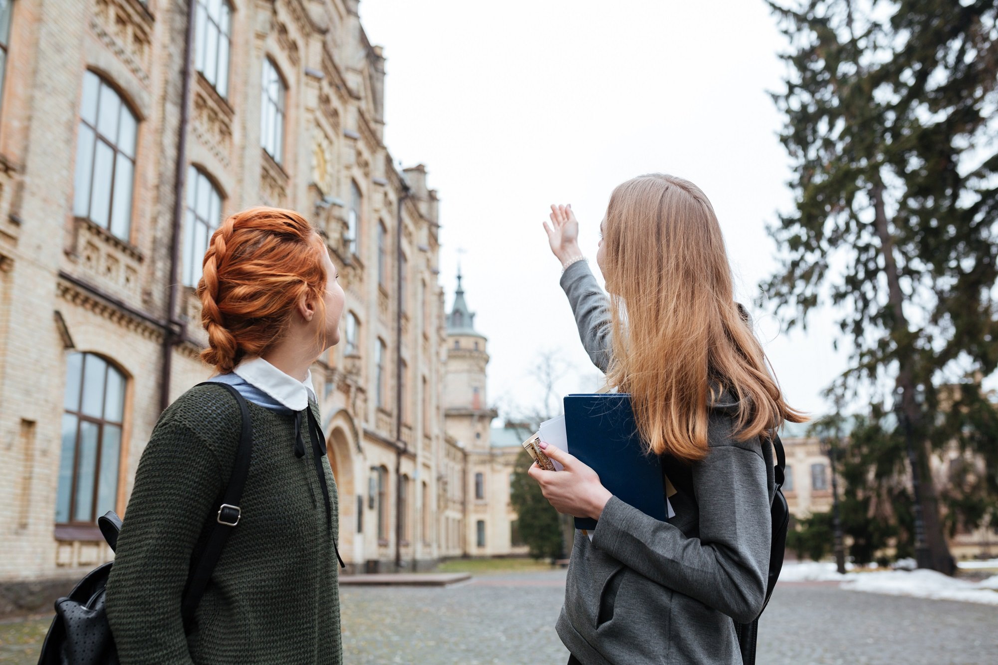 young teenage girls outside a university